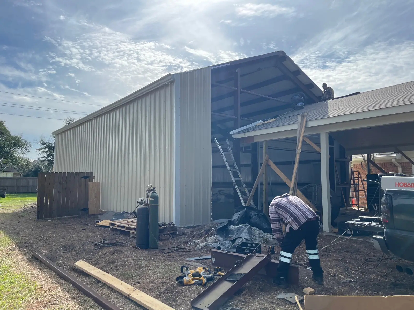 Custom metal shop building under construction in Pearland, Texas by 12 Bravo Construction