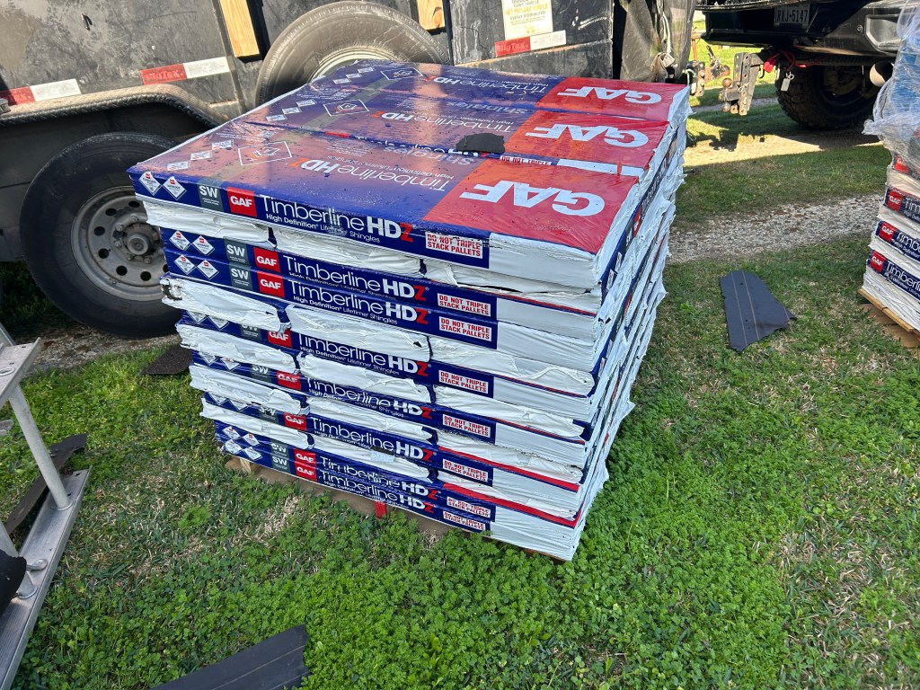 Pallet of GAF Timberline HDZ shingles and roofing materials delivered for a residential roof replacement in Freeport Texas