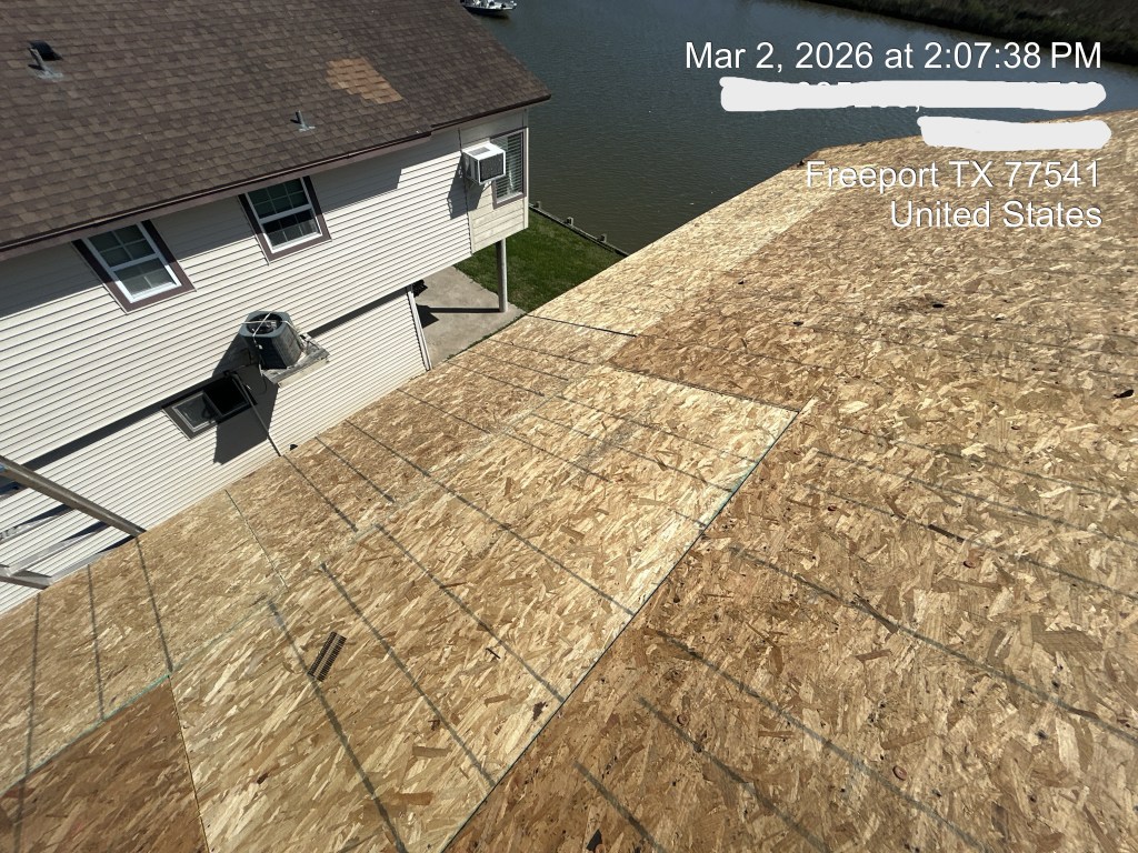 New OSB roof decking installed during residential roof replacement project in Freeport Texas