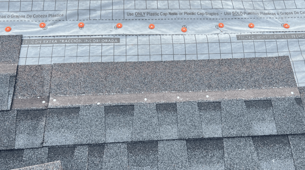 GAF Timberline HDZ shingles being installed over synthetic underlayment on residential roof