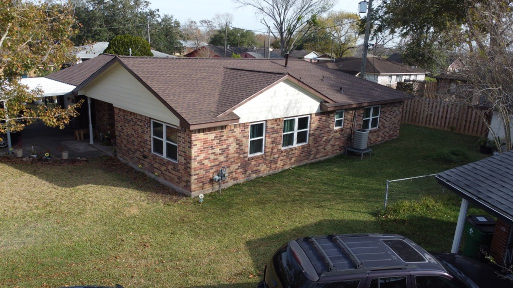 Architectural shingle roof replacement completed on a residential home in Pearland Texas by 12 Bravo Construction